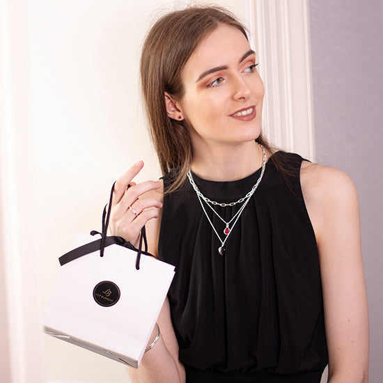 Model holding Lily Blanche gift bag