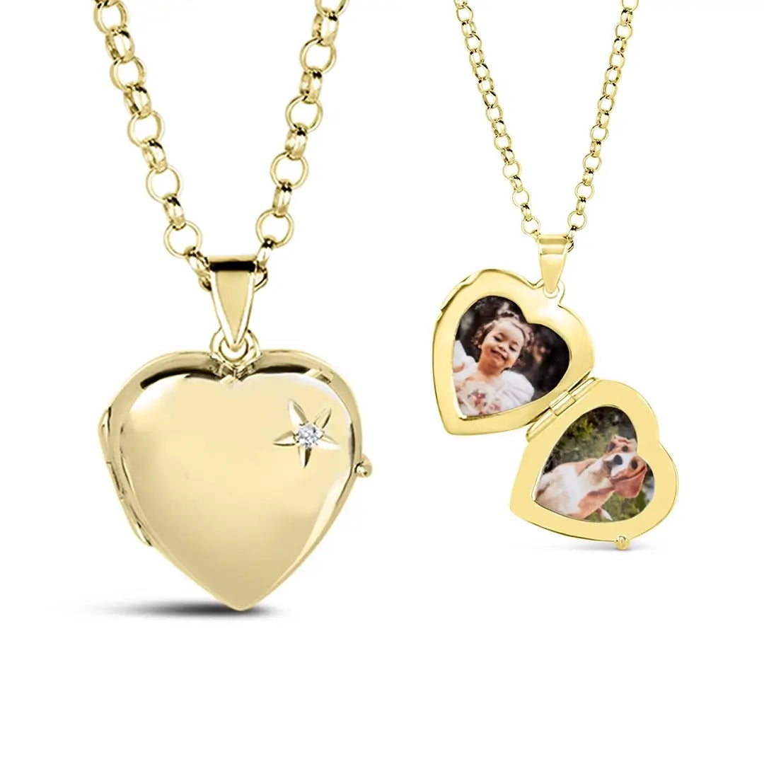 Gold heart-shaped locket necklace with a small diamond accent on the front. The locket is shown both closed and open — inside are two heart-shaped photo spaces displaying a picture of a smiling child and a dog.