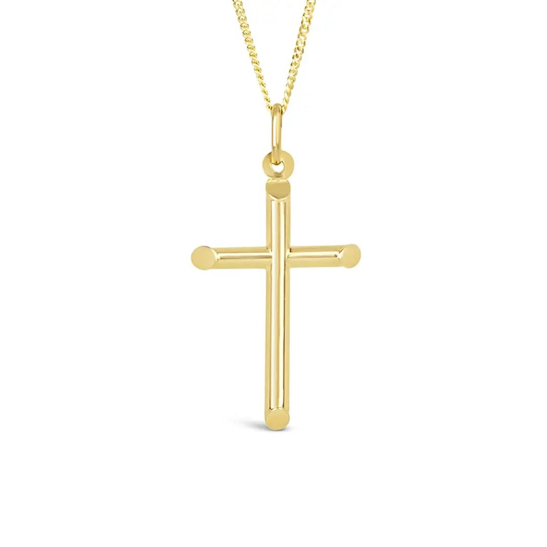 Close-up product image of a polished gold cross pendant necklace on a fine chain against a white background