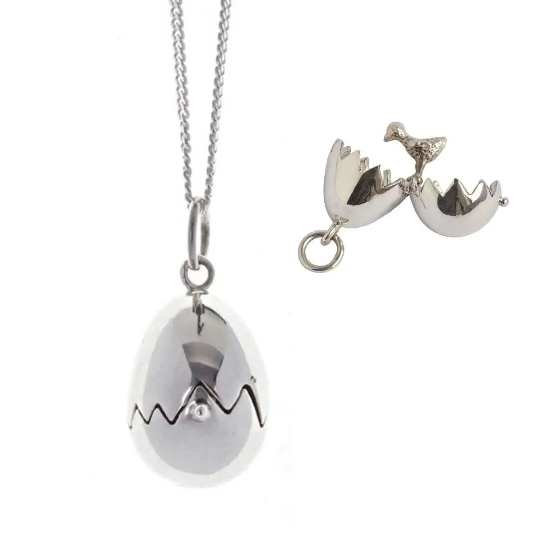 Sterling silver chick hatching locket necklace with polished egg design and cracked shell detail on fine silver chain