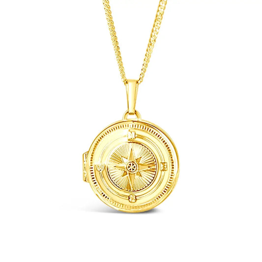 Gold vermeil compass locket necklace featuring engraved compass design with directional markers, white background