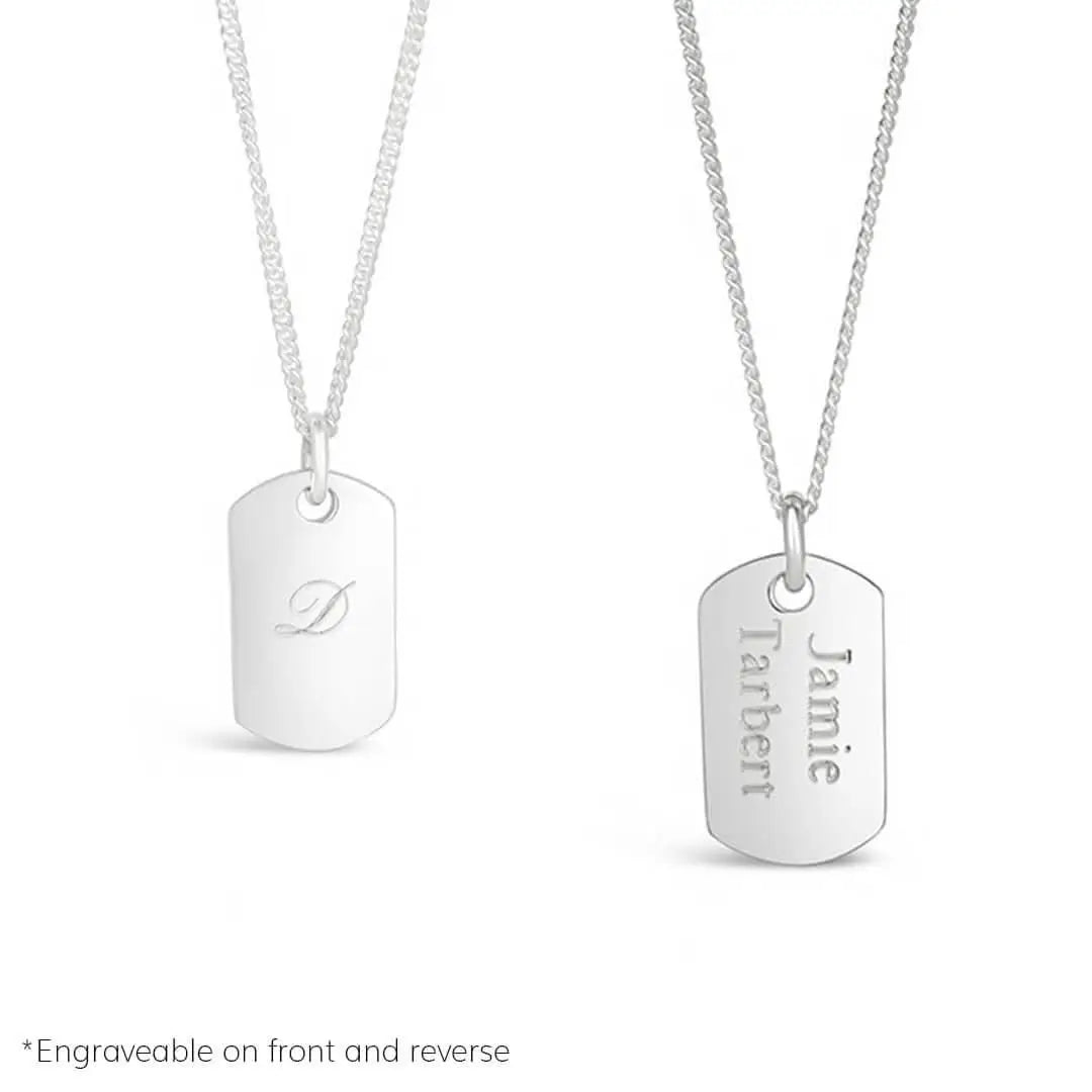 Sterling silver dog tag necklace engraved with initial and name, showing front and reverse personalisation options on white background.