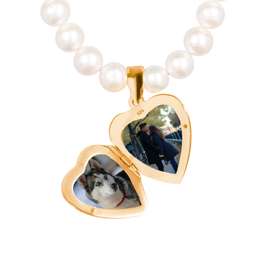 Gold locket opens to hold two photos