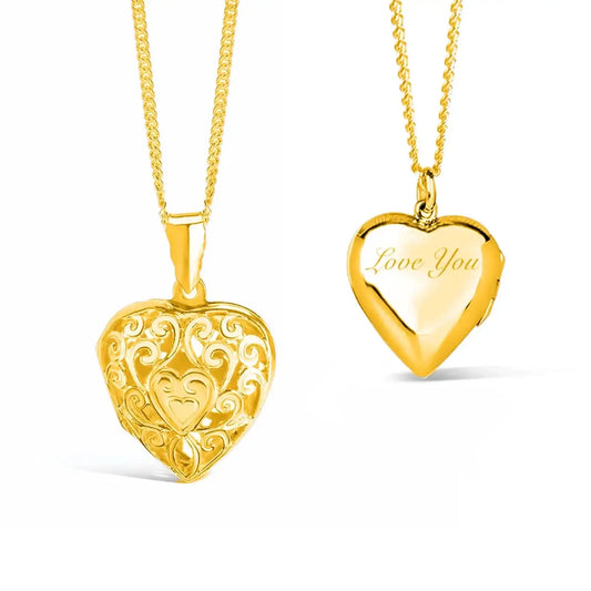 Front and back views of a gold vermeil filigree heart locket necklace. The front features an intricate openwork scroll design with a small heart at the centre, while the polished back is engraved with the words "Love You". The heart-shaped locket hangs from a matching gold vermeil chain against a white background.