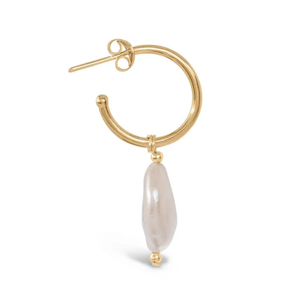 Close-up side view of gold hoop earring with elongated coin pearl drop detail