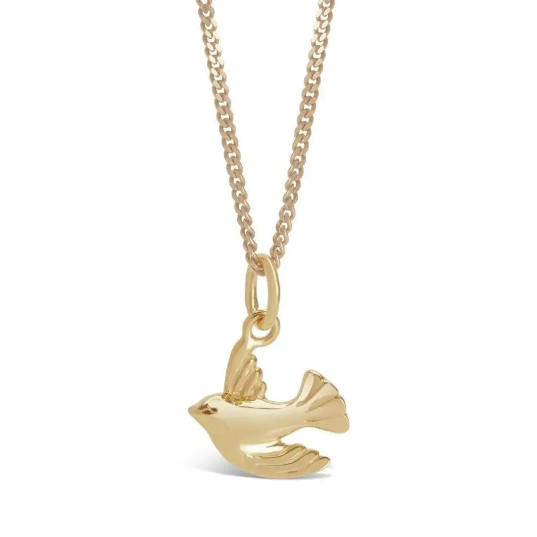 Gold bird charm necklace on fine chain, polished minimalist bird pendant jewellery