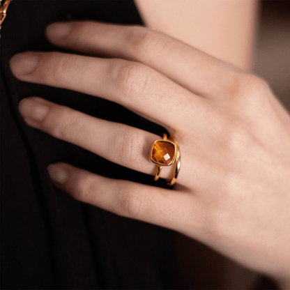 close up of model wearing citrine cocktail ring in gold