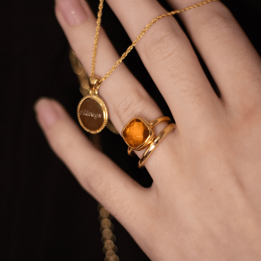 close up of model wearing citrine cocktail ring in gold