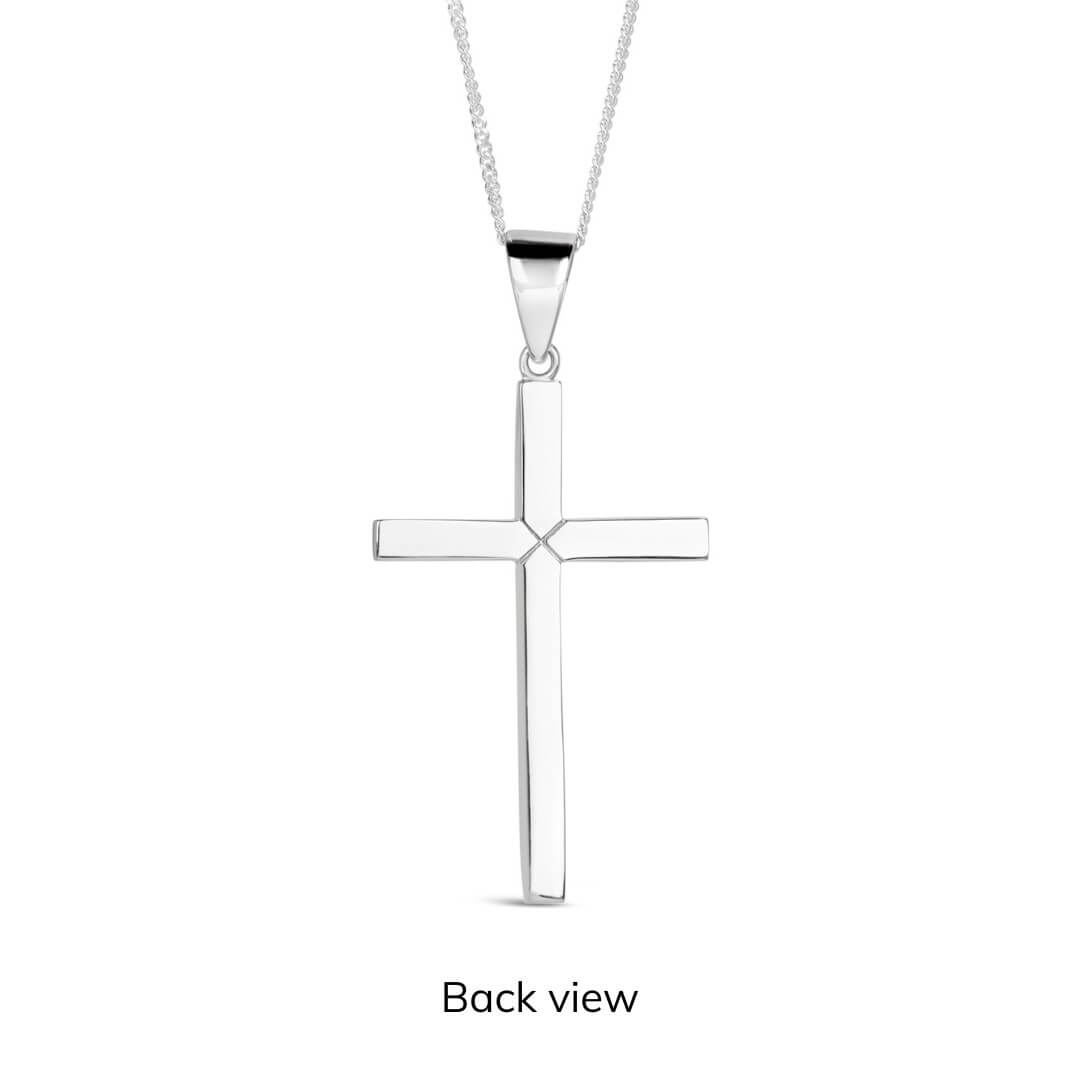 Silver cross pendant on a white background back view