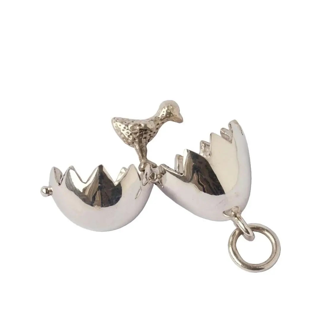 Sterling silver chick locket opened to reveal miniature chick inside cracked egg shell pendant