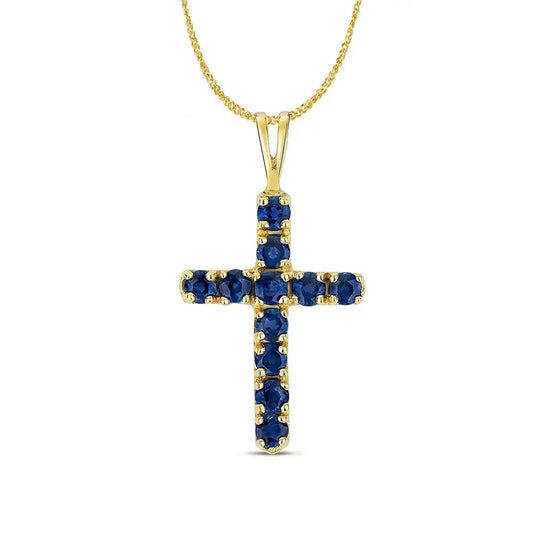 Gold cross pendant with faceted blue sapphires on fine chain, classic gemstone jewellery design
