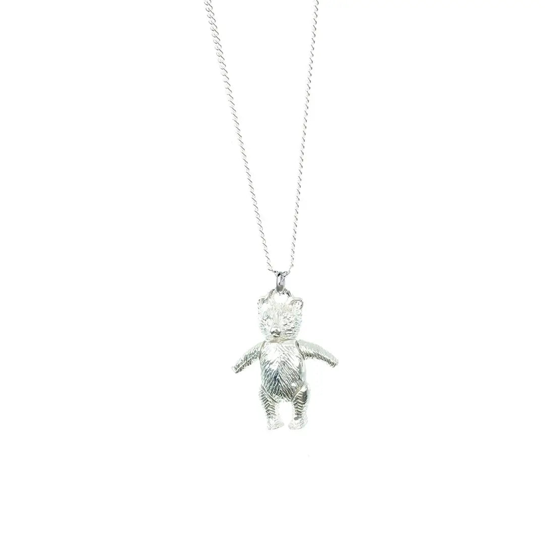 Sterling silver teddy bear pendant necklace on a fine silver chain, displayed against a clean white background.