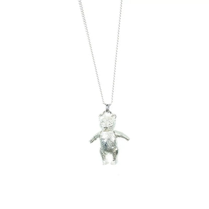 Sterling silver teddy bear pendant necklace on a fine silver chain, displayed against a clean white background.