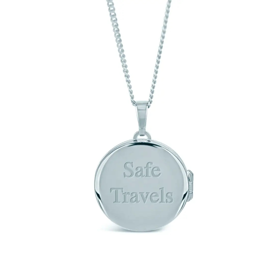 Sterling silver round locket necklace engraved with “Safe Travels” on the back on a white background
