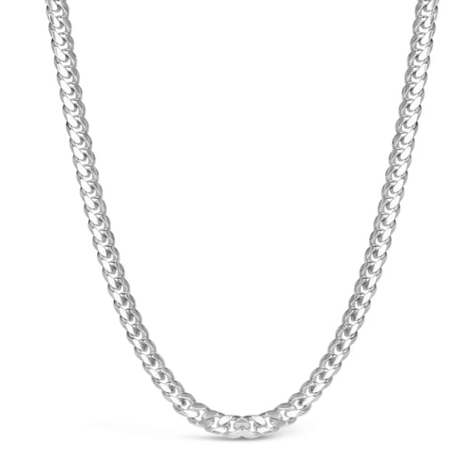 Sterling silver Cuban link chain necklace displayed on white background in a curved shape.