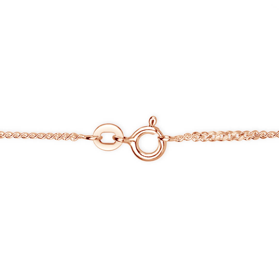 Close-up of rose gold vermeil curb chain necklace with spring ring clasp and extension link on white background.