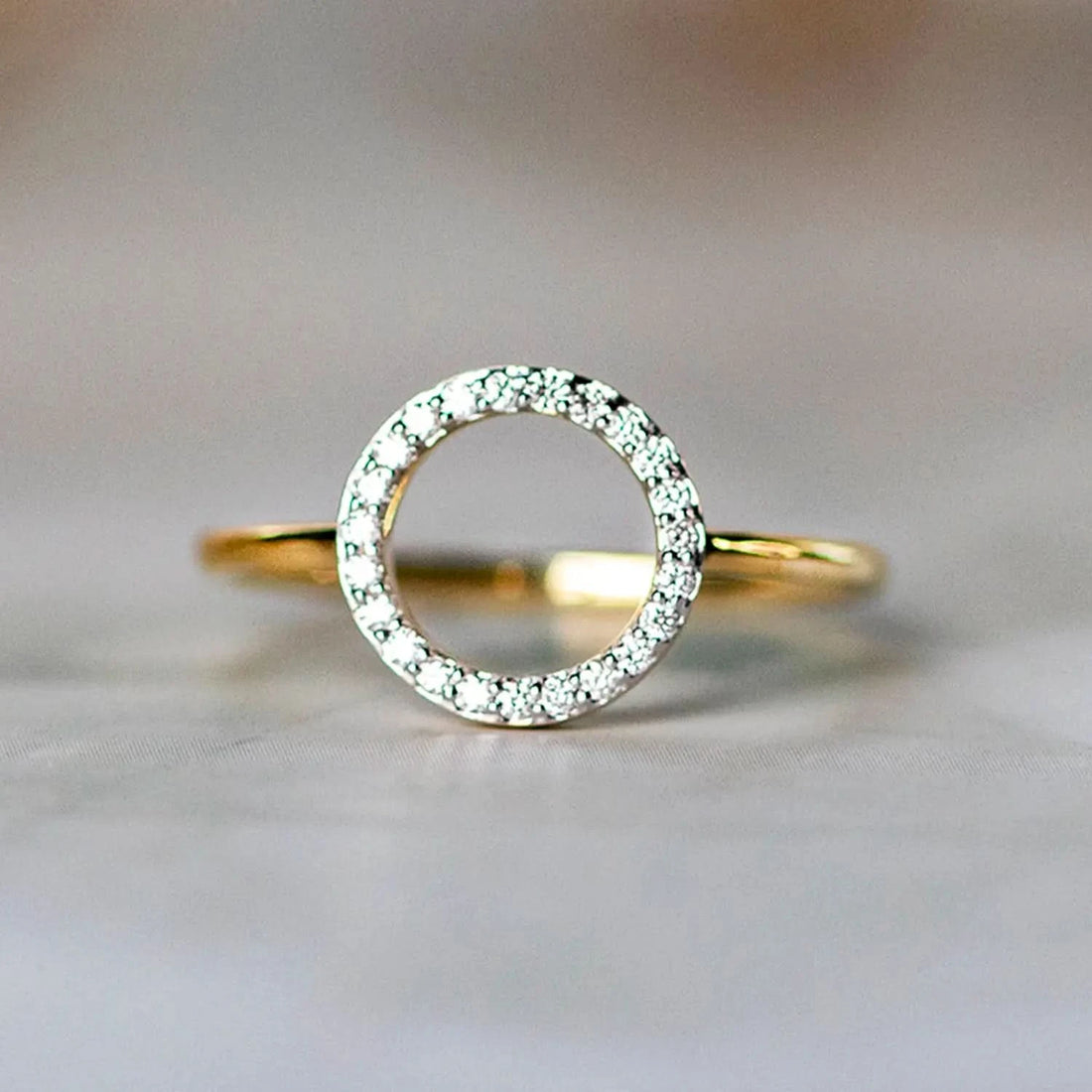 Gold ring with open circle diamond pavé design
