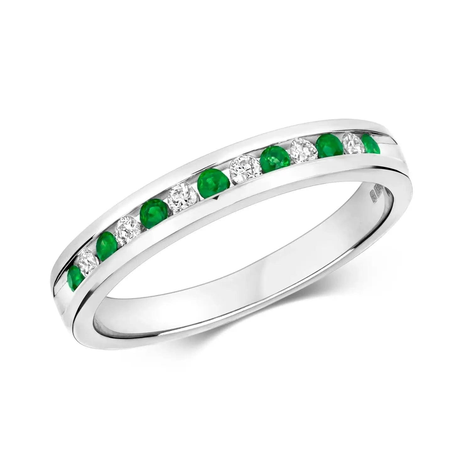 emerald and diamond solid white gold band ring on white background