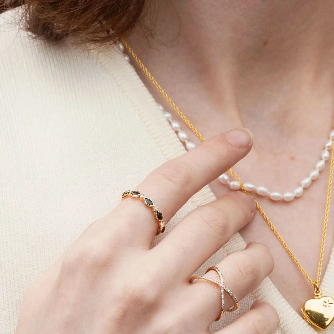 model wearing sapphire and diamond gold ring