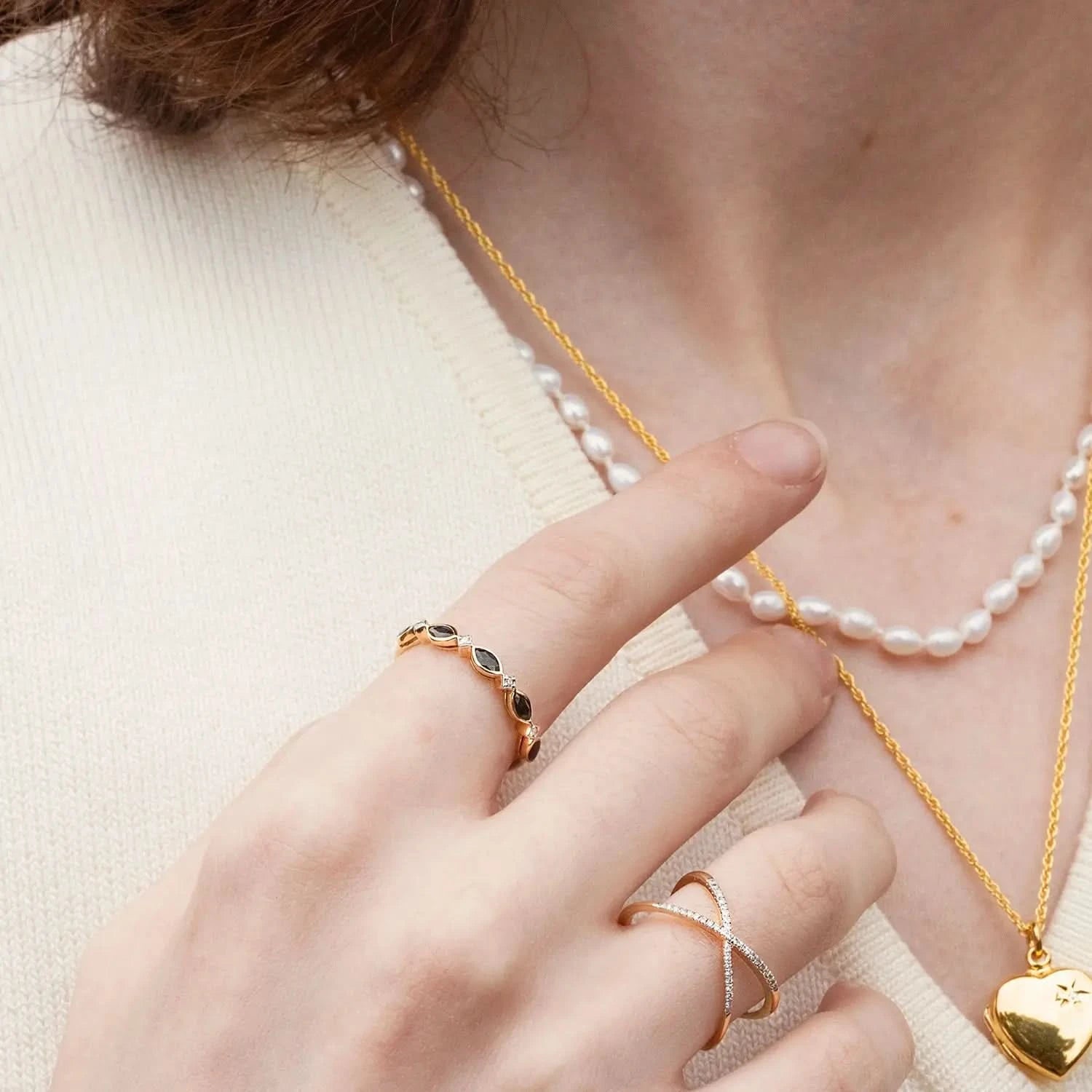 model wearing sapphire and diamond gold ring