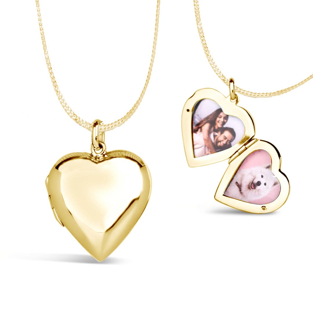 A gold heart-shaped locket with two photos displayed on its front side
