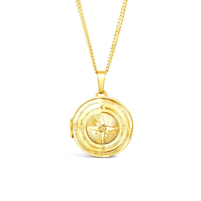Gold compass pendant necklace on a white background front view