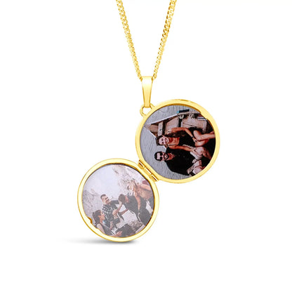 Gold locket necklace with two circular photo panels on a white background