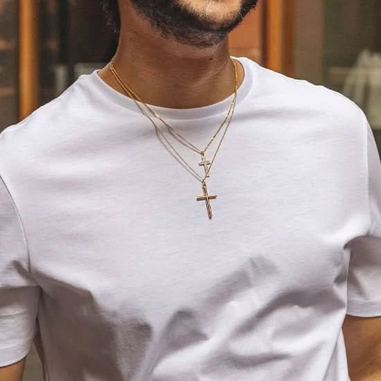 man wearing gold cross necklace, sturdy gold curb chain, high polish finish, rounded edges, religious Christian pendant for men and women, diamond cross necklace, double cross necklace, two chains