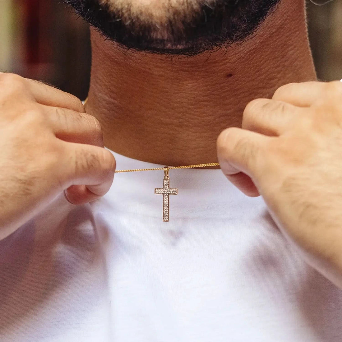 male model wearing diamond cross gold necklace with solid gold close curb chain 