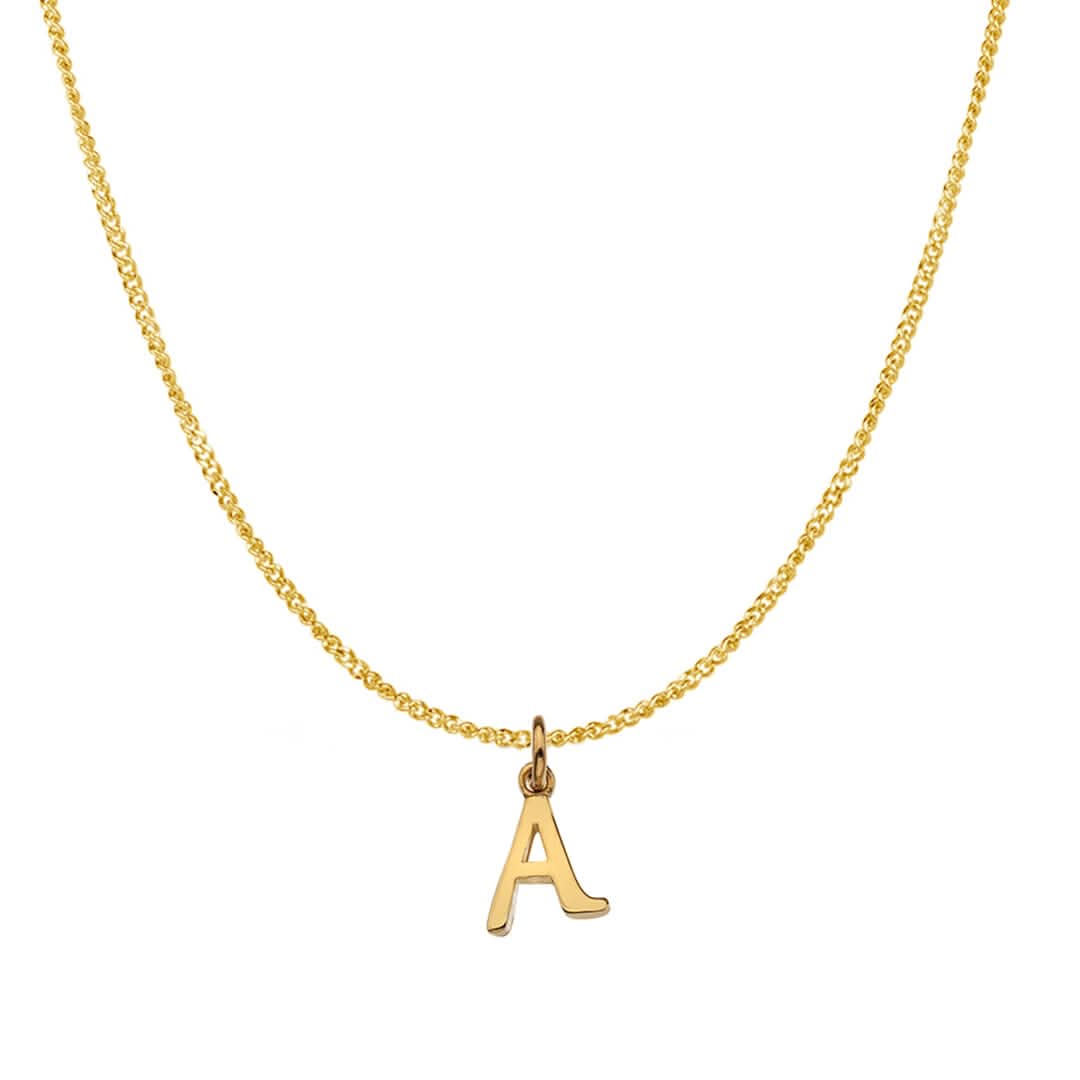 An alphabet initial A necklace in solid 9 carat gold hanging on a solid 9 carat gold close curb chain with a white background