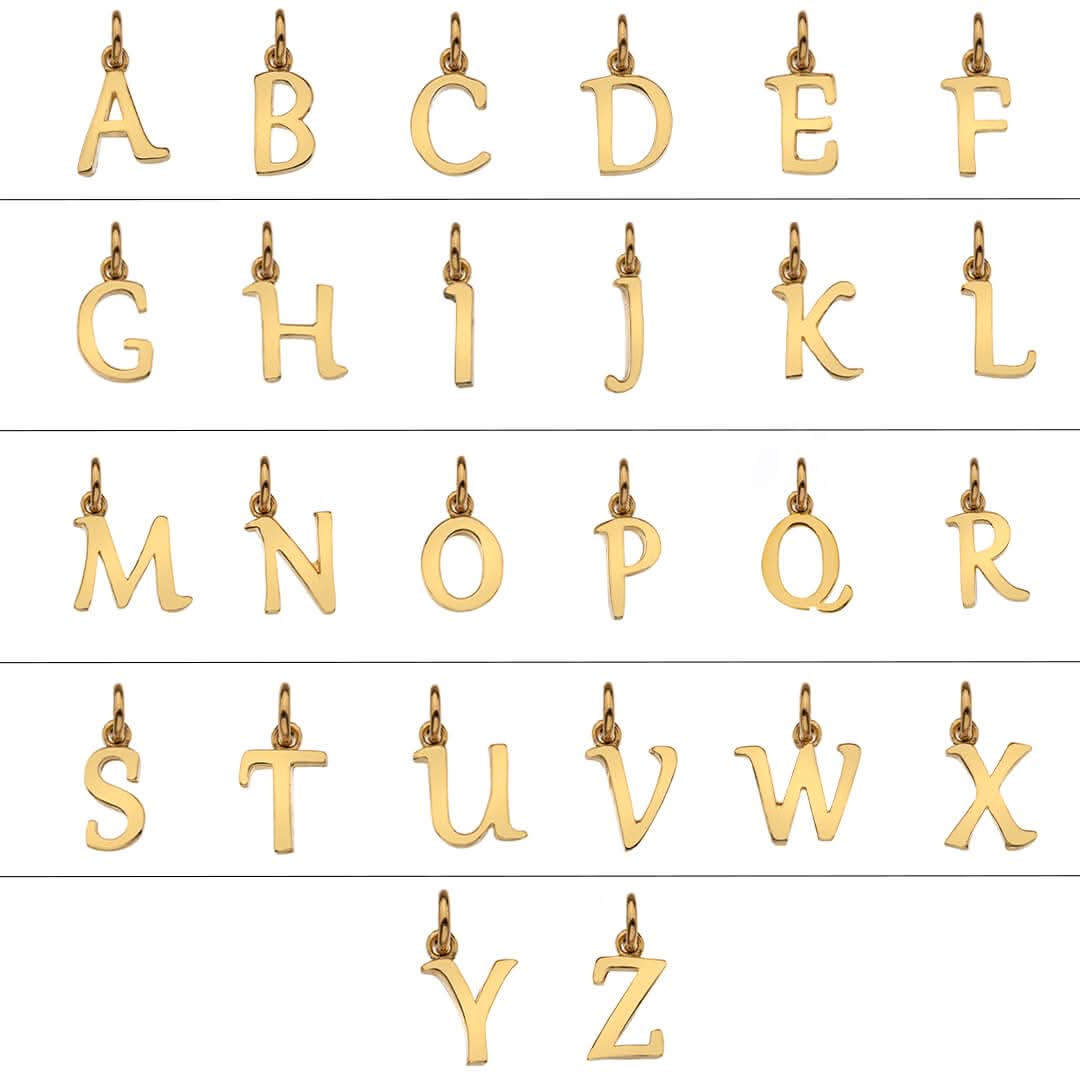 Grid of 26 solid 9 carat gold initial letter necklaces A - Z - 26 forming the alphabet on a white background