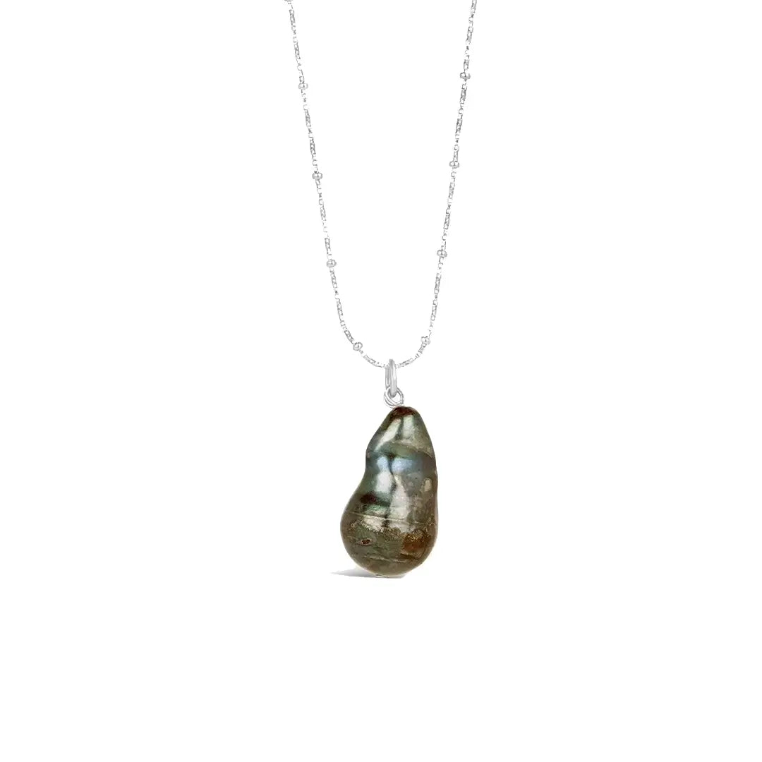 Sterling silver necklace featuring a unique green baroque pearl pendant with natural organic shape on a delicate silver chain.