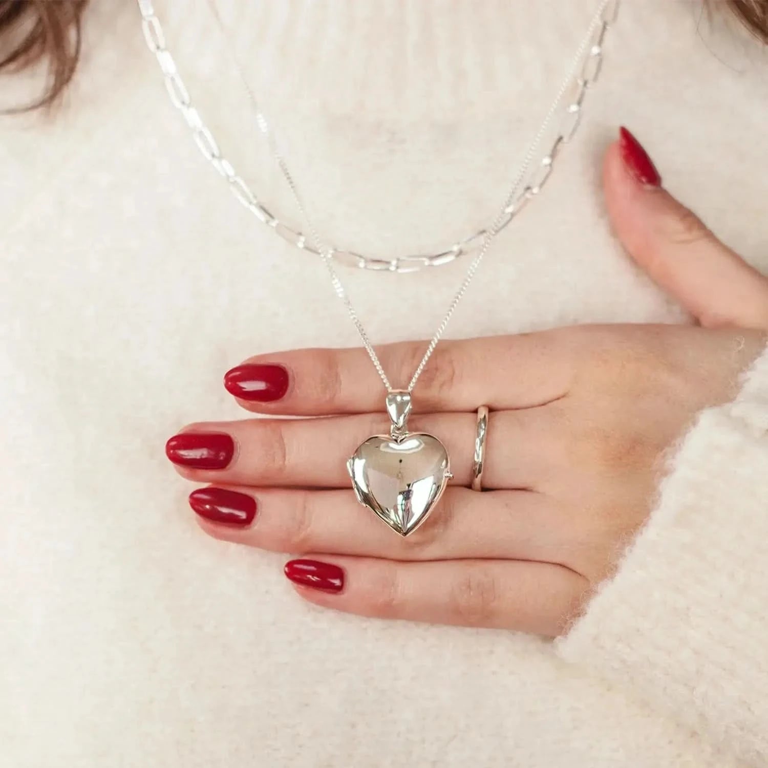 woman wearing Silver heart Necklace for ashes, memorial necklace, locket with one photo and ashes storage, silver curb chain, engraving, silver paperclip chain