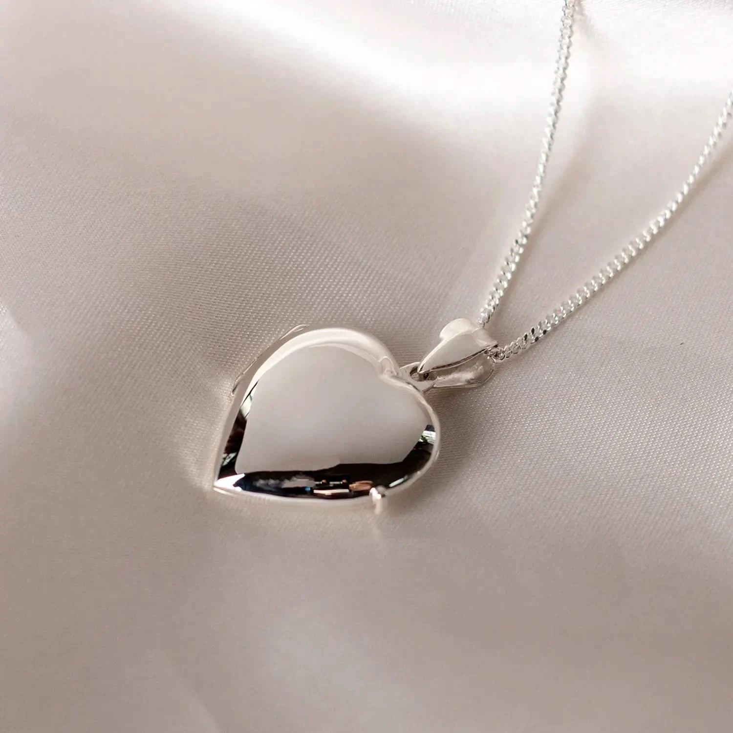 Silver heart Necklace for ashes, memorial necklace, locket with one photo and ashes storage, silver curb chain, engraving, silk sheet background