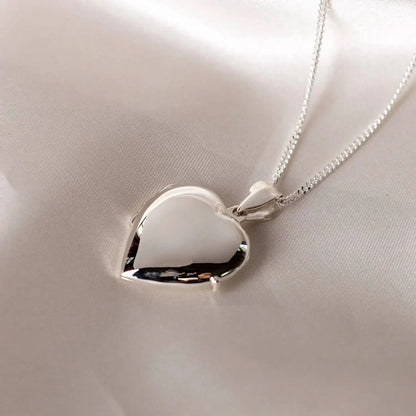 Silver heart Necklace for ashes, memorial necklace, locket with one photo and ashes storage, silver curb chain, engraving, silk sheet background