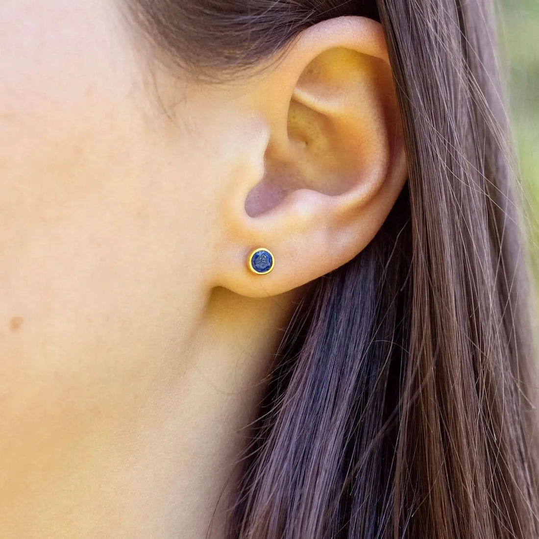 model wearing lapis lazuli silver stud earrings 