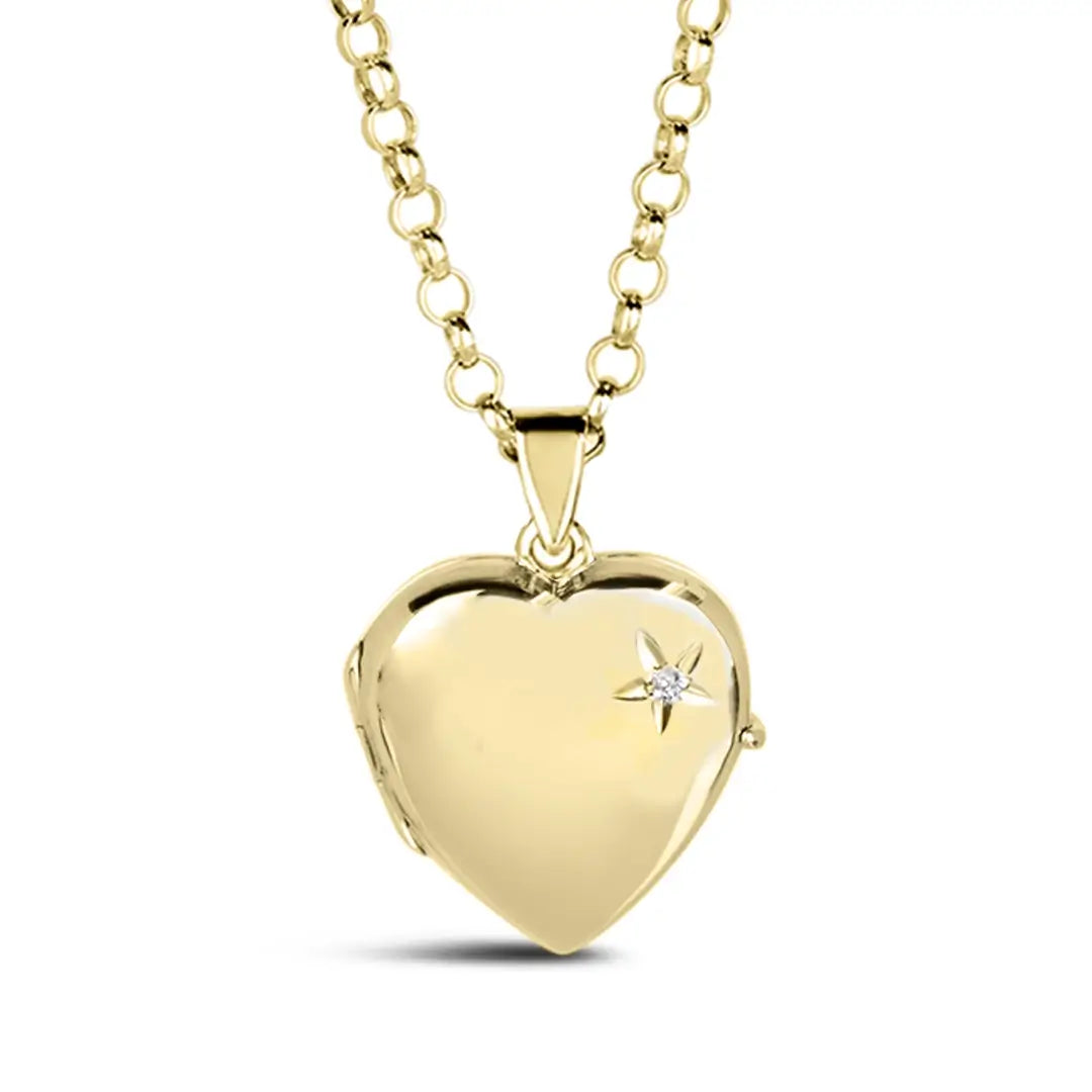Closed gold heart locket necklace with a small diamond accent in a starburst design on the front, hanging from a gold chain.