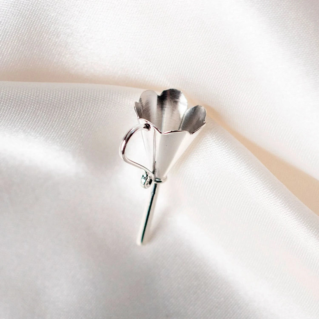 silver ashes funnel for silver ashes storage locket, silk background