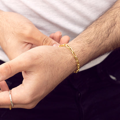 model wearing men's paperclip gold chain bracelet