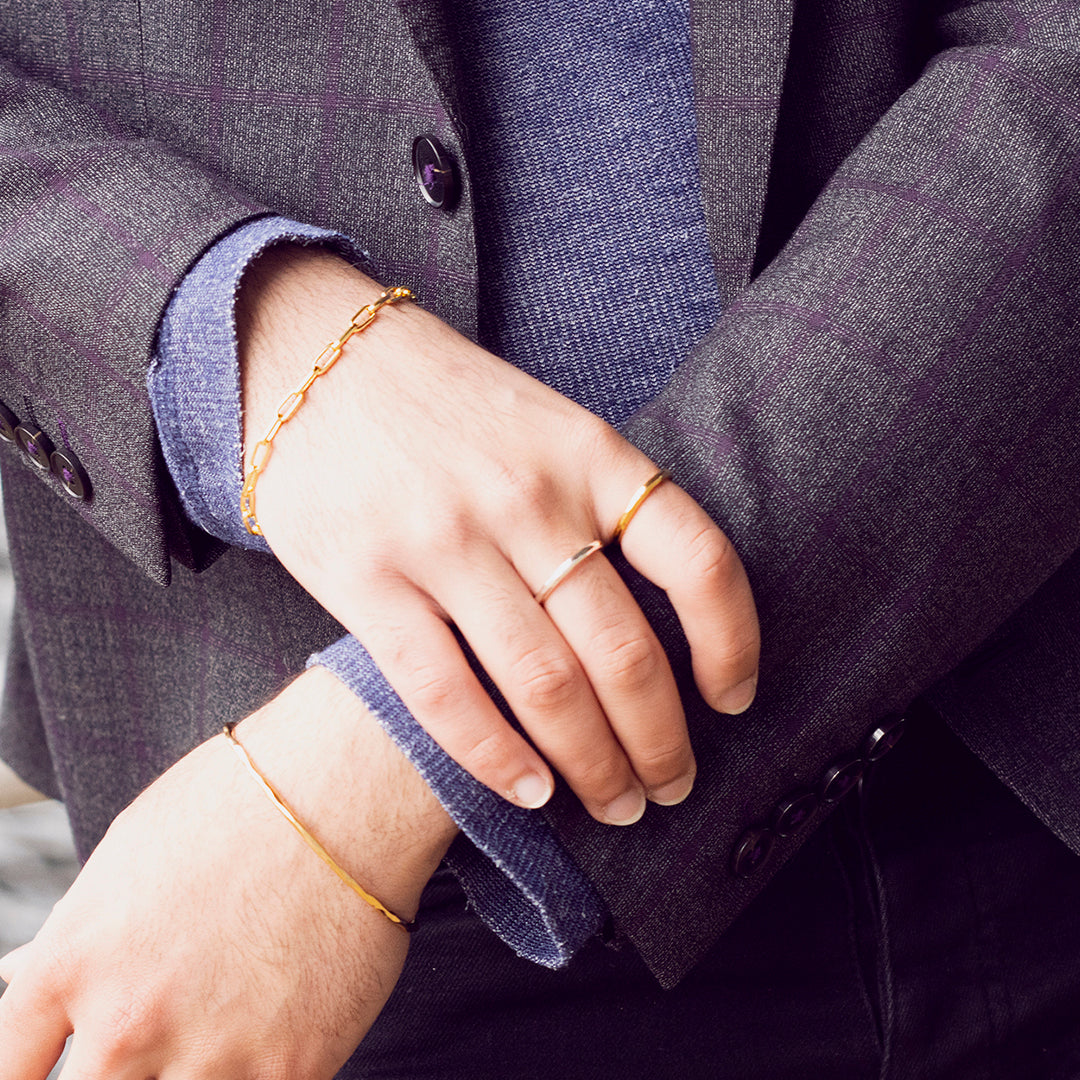 closeup of model wearing men's hammered gold ring