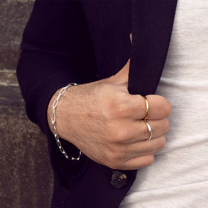 closeup of model wearing men's hammered gold ring