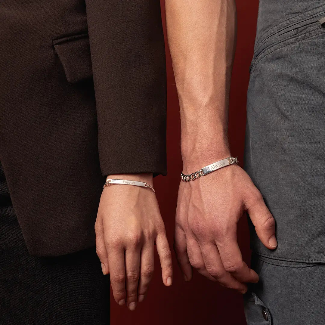 Two models wearing engraved sterling silver ID bracelets with Forever and Always visible