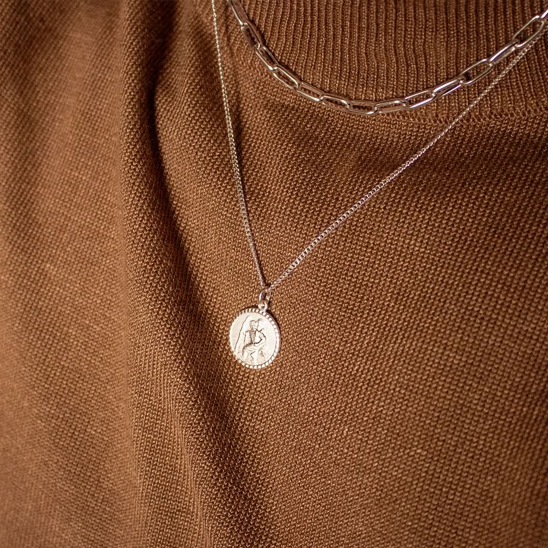 model wearing silver Saint Christopher necklace with chain