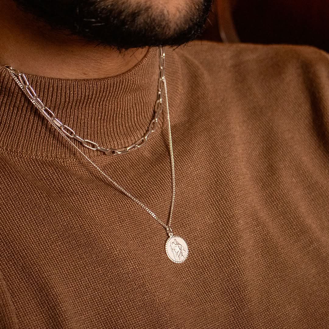 model wearing silver Saint Christopher necklace with chain