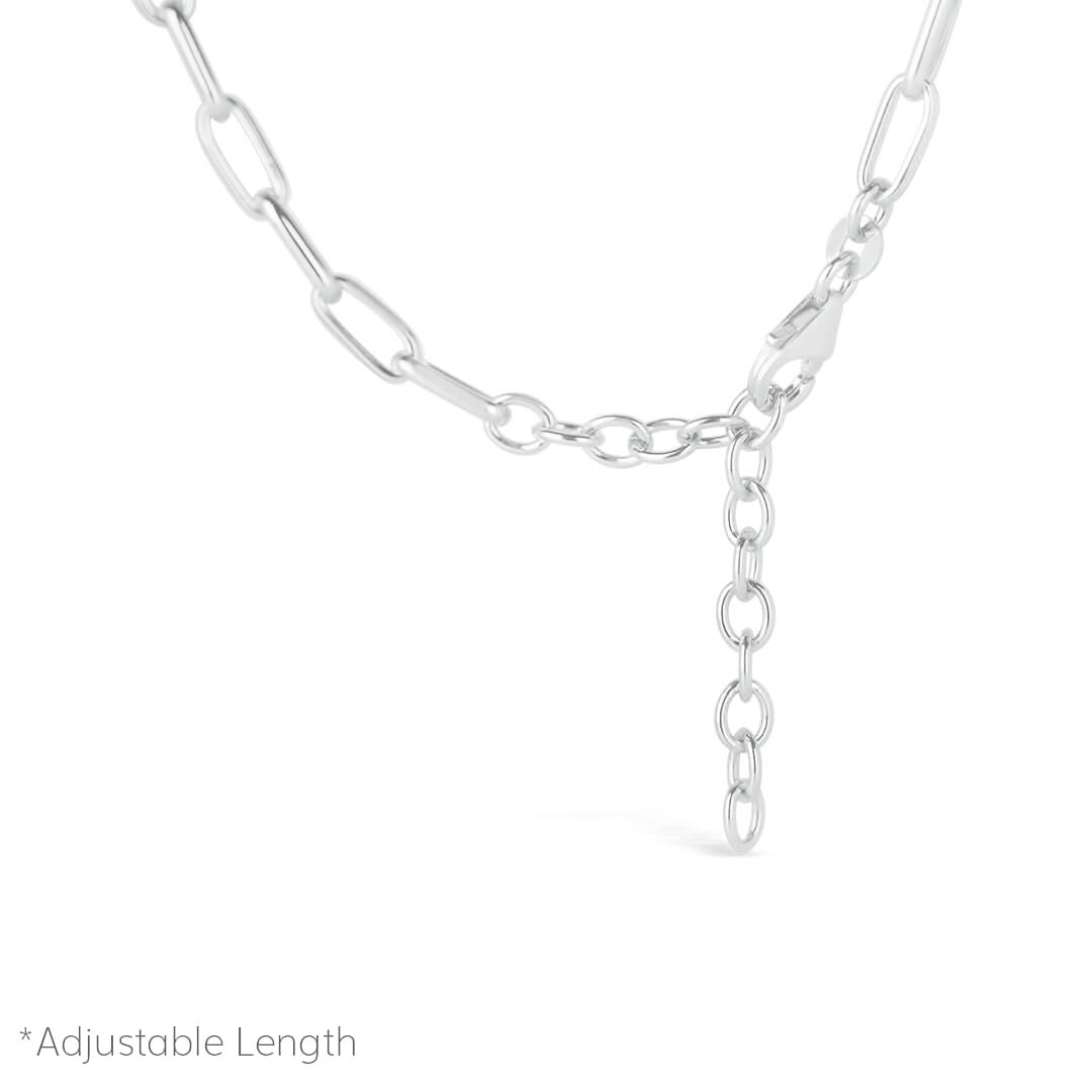 silver paperclip chain close up of chain catch on white background
