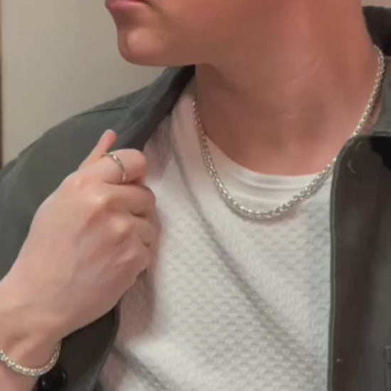 sterling silver spiga chain and bracelet on man.