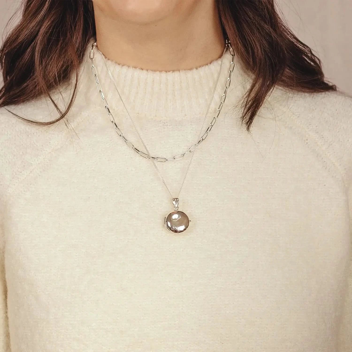 woman wearing Silver round Necklace for ashes, memorial necklace, locket with one photo and ashes storage, silver curb chain, engraving, silver paperclip chain