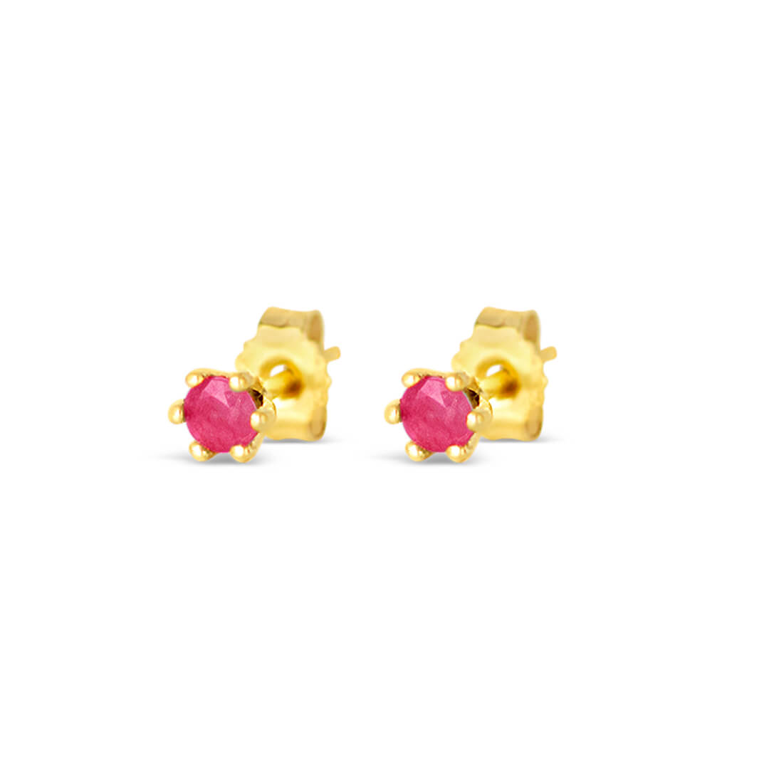 ruby mini stud earrings in gold on a white background with butterflu fastenings