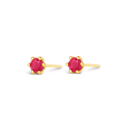 ruby mini stud earrings in gold on a white background