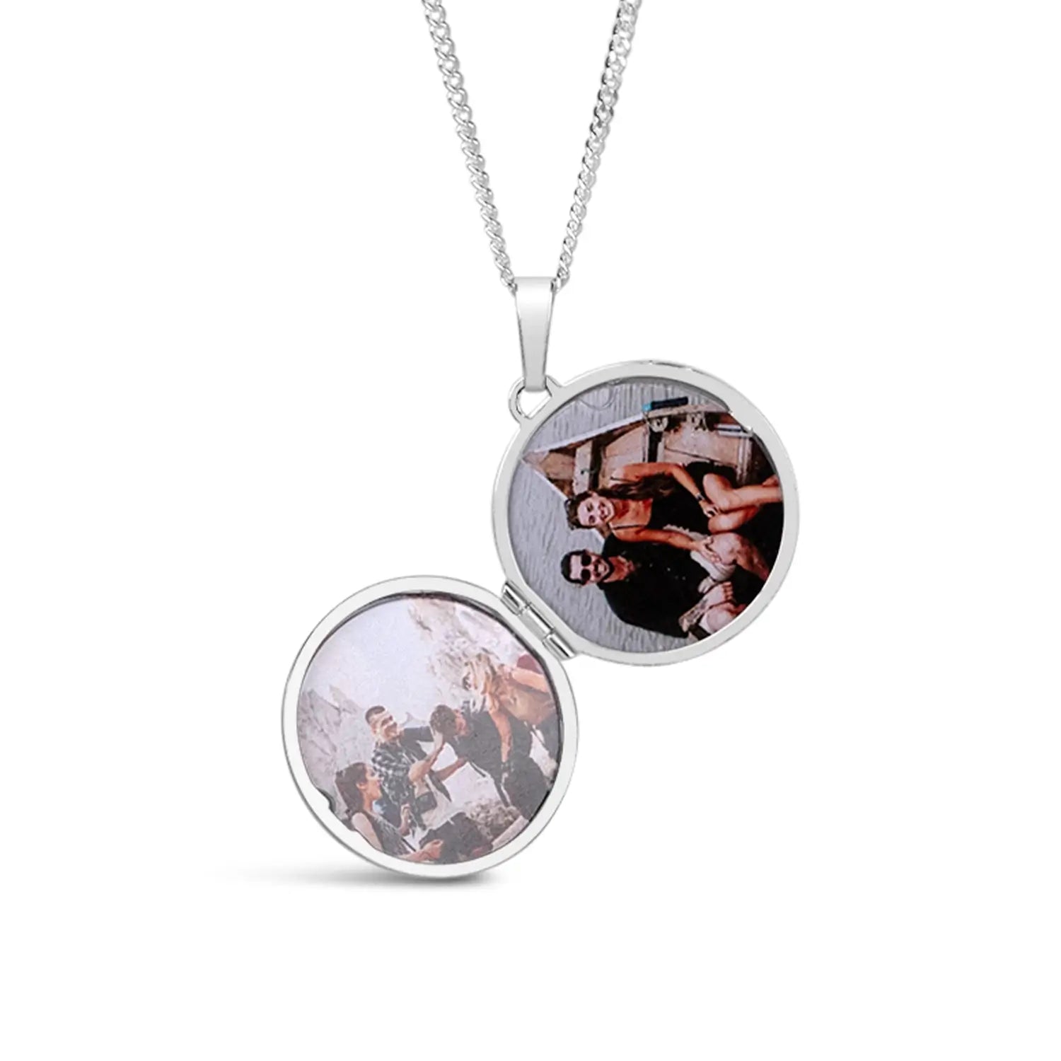 Silver locket with two round photo panels on a white background